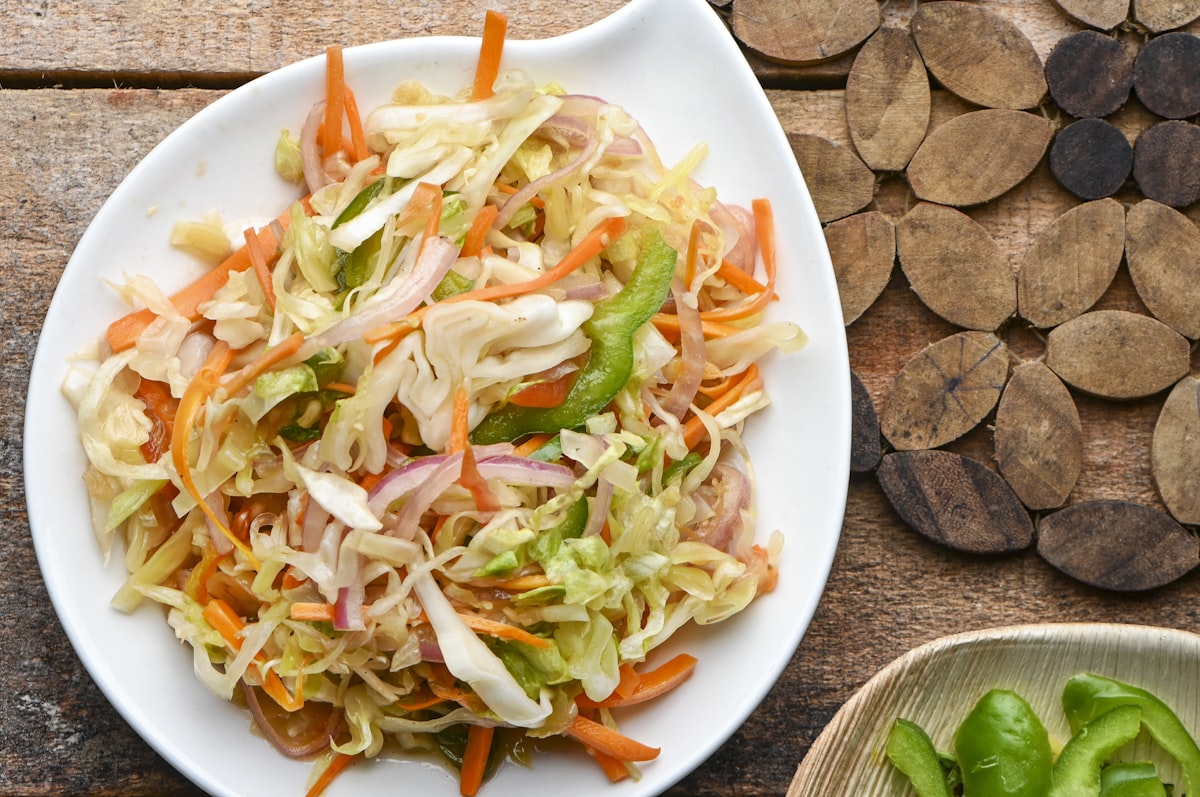 vegetable salad on white ceramic plate
